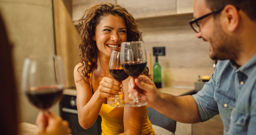 Friends Enjoying Wine in a Sunny Kitchen